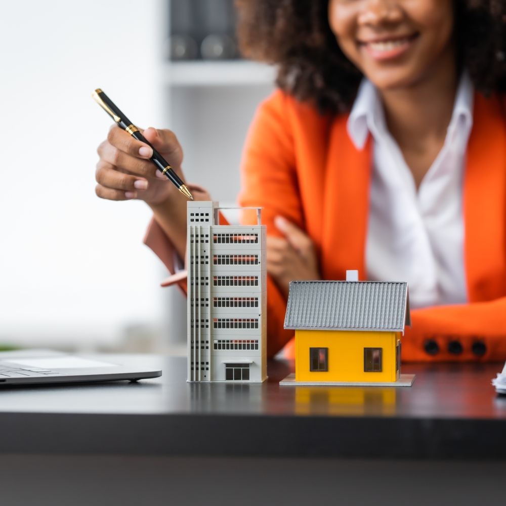 African American realtor working at desk, Housing estate, Vacanc African American realtor working at desk, Housing estate, Vacancy, Prime location, Low Rise